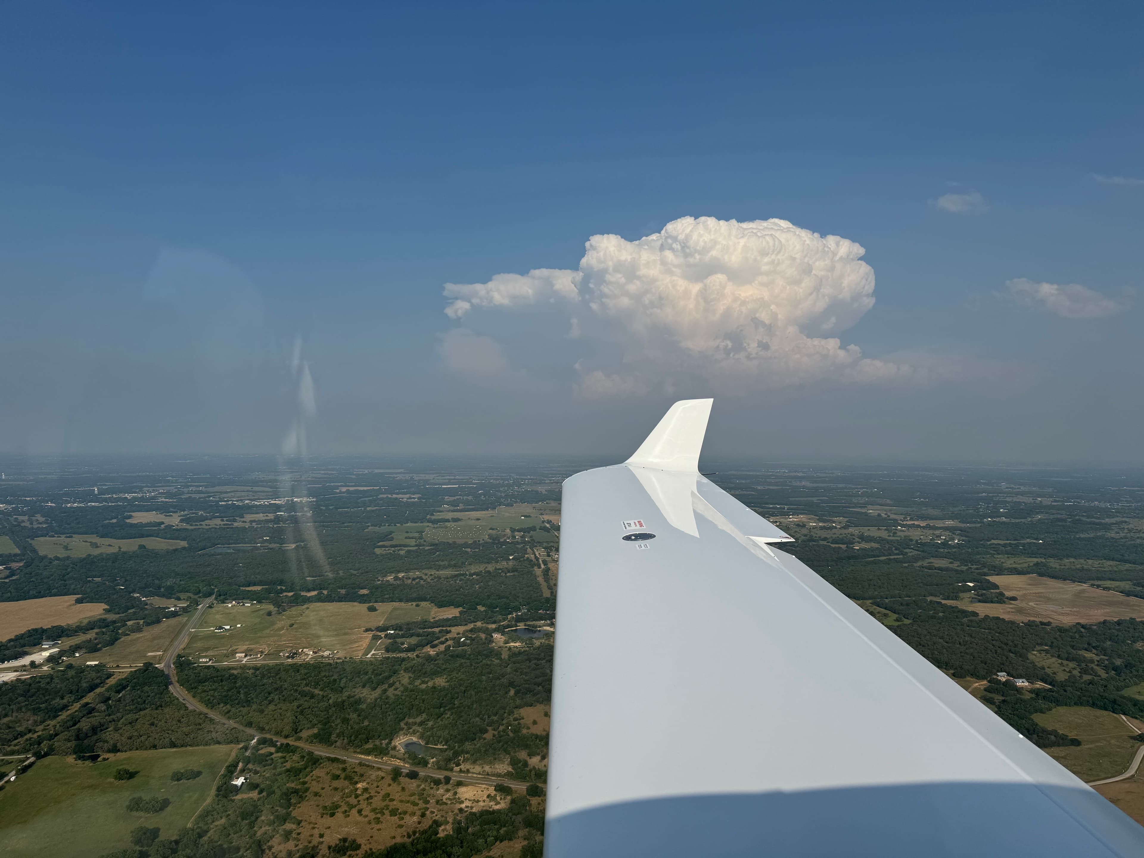 Aerial view over cumulus clouds from the TB10 wing